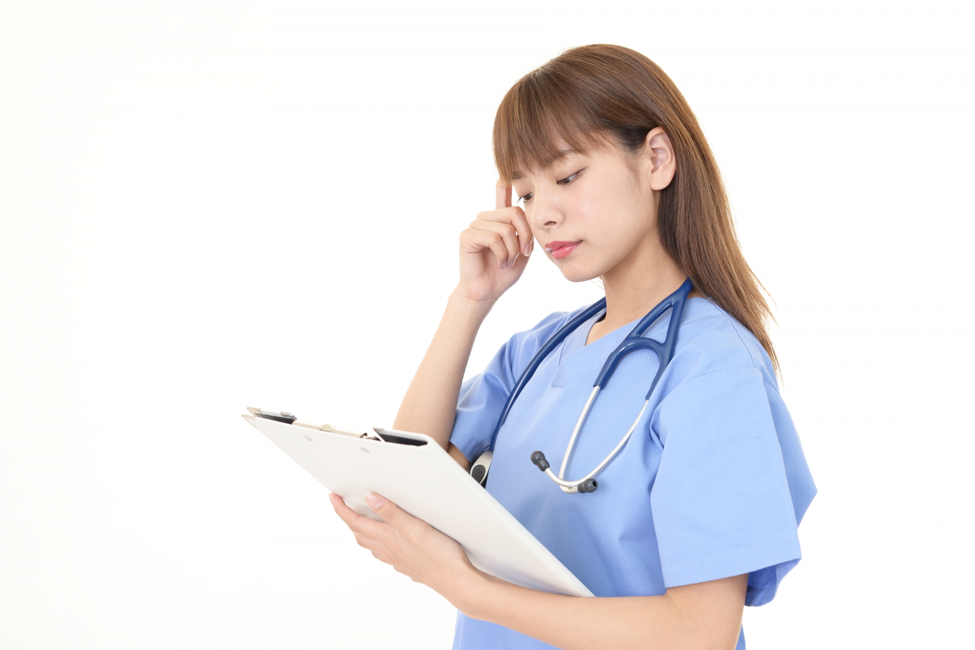 Healthcare professional reviewing a patient chart